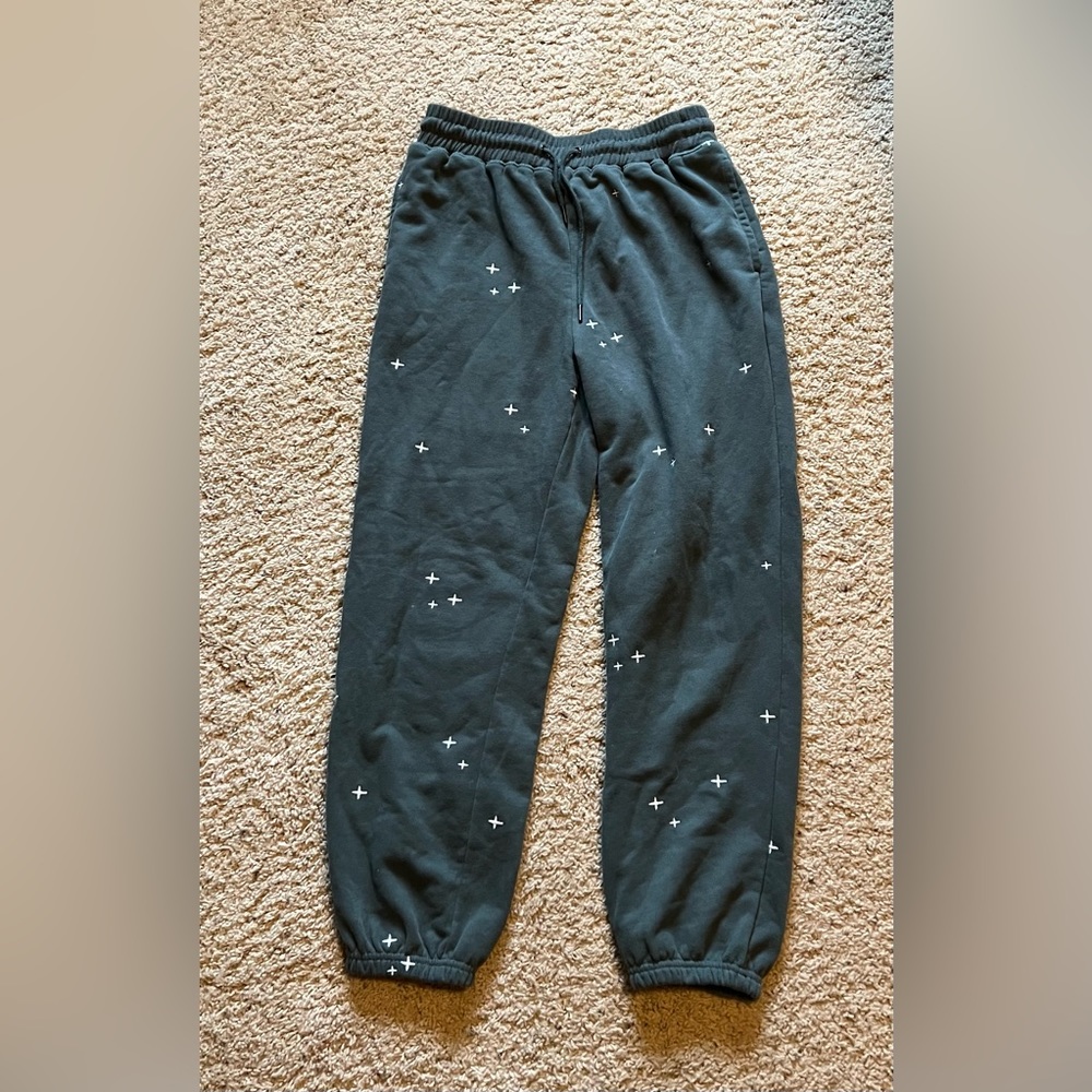 Green hem and thread sweats